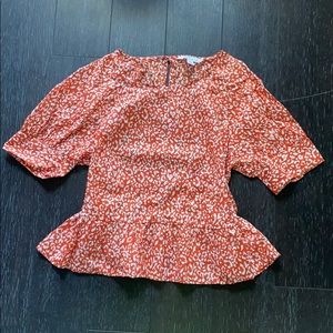 woman’s orange leopard shirt